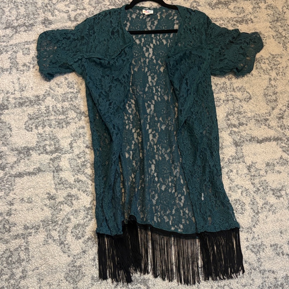 LuLaRoe Monroe duster in green floral lace with black fringe.
